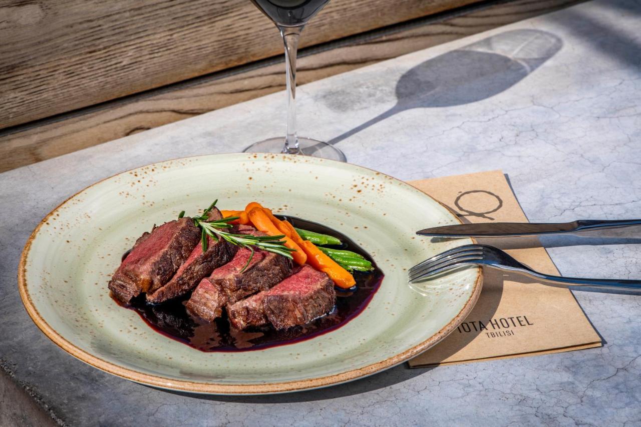 Iota Hotel Тбилиси Екстериор снимка A steak prepared with a red wine reduction